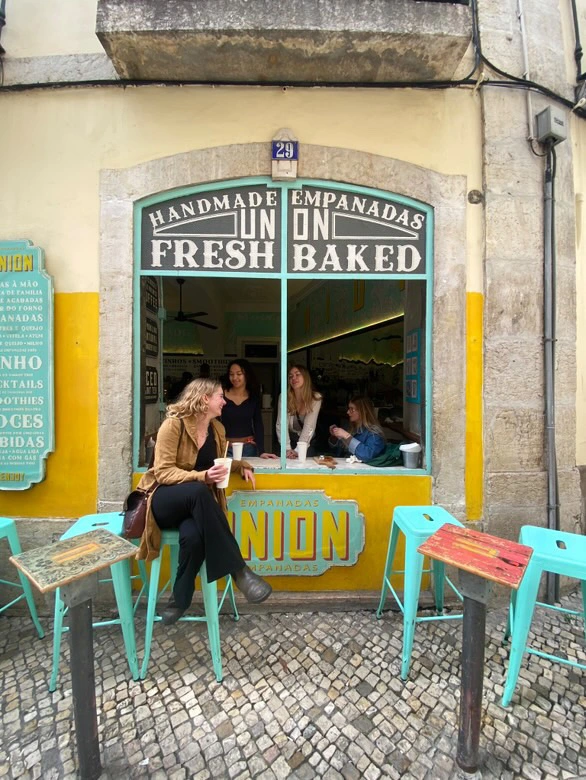 Intern abroad enjoying empanadas in Lisbon
