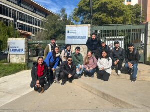 Group of interns in Chile posing for a group photo outdoors.