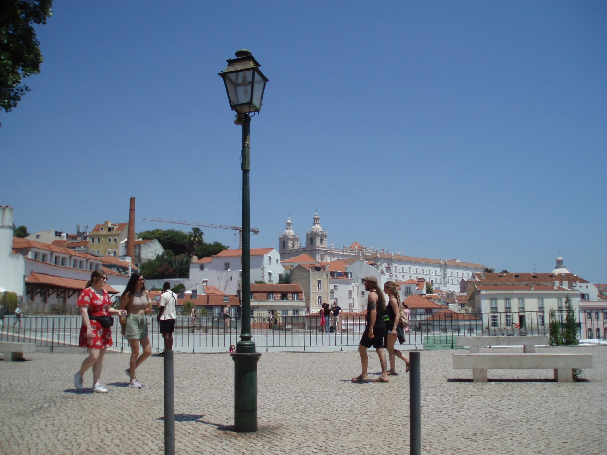 People walking on a sunny city square