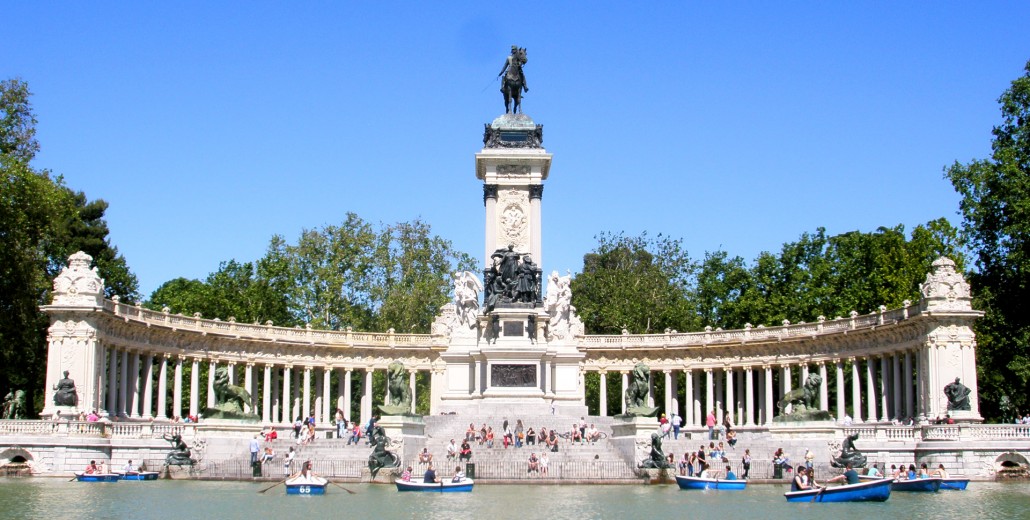 Monument to King Alfonso XII by lake in Retiro Park, Madrid.