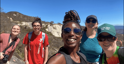 5 students standing in front of a canyon during some Mexico international internships.