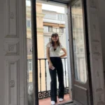 Student standing on balcony in Madrid
