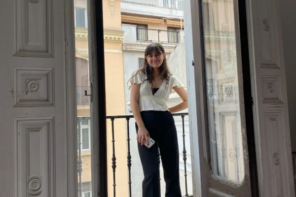 2026 Internships in Madrid (2) Student standing on balcony in Madrid
