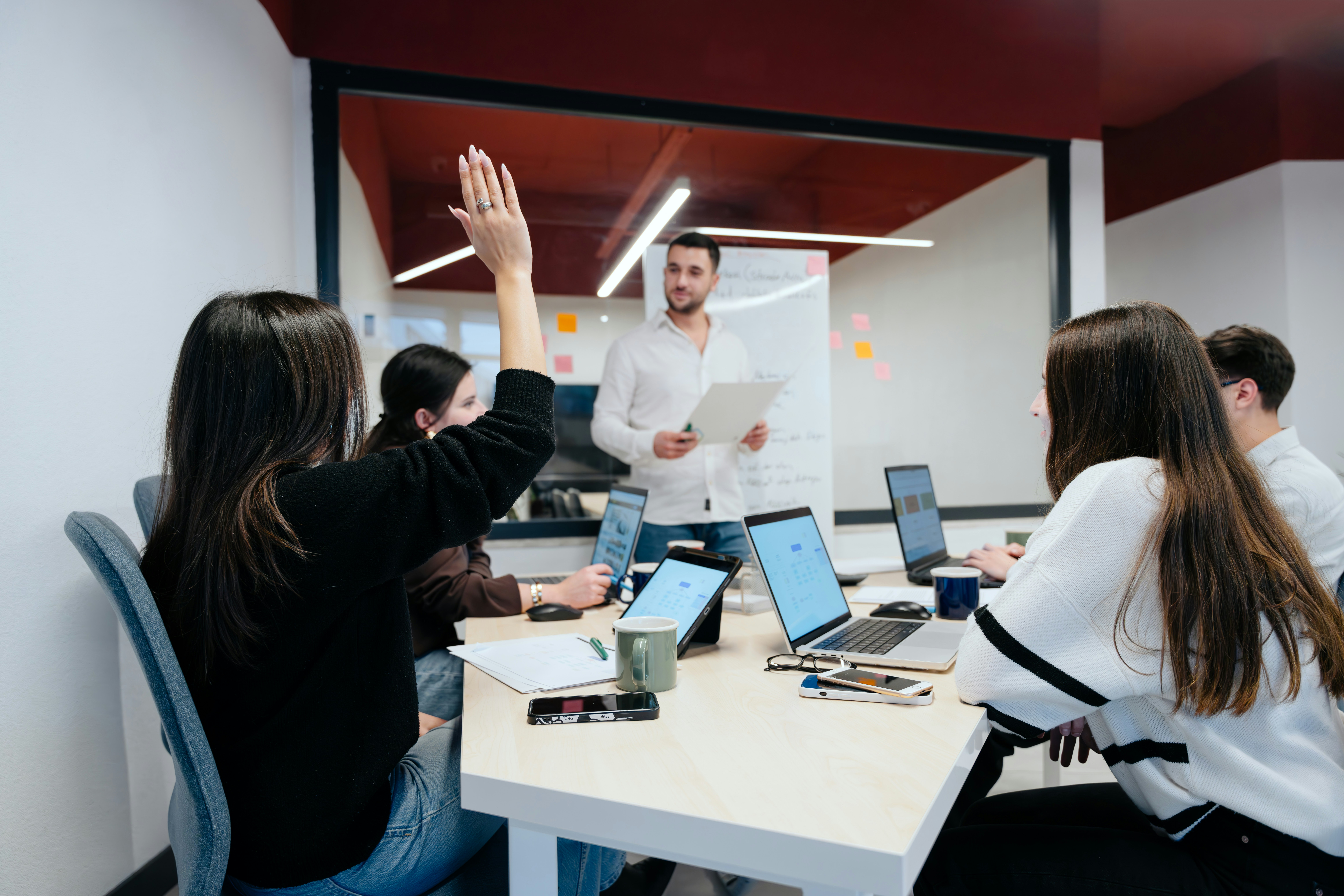 Marketing interns collaborating in an office meeting